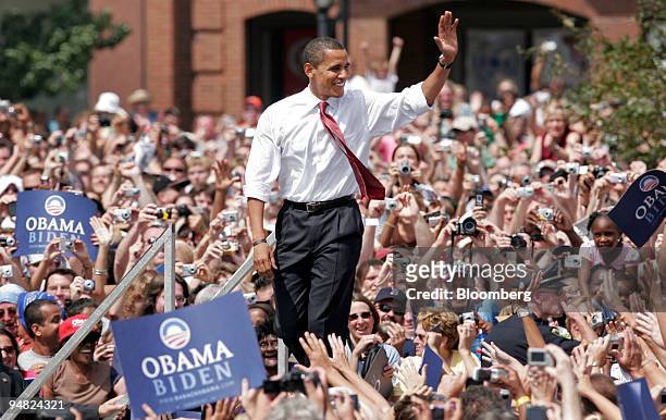 Barack Obama, U.S. Senator from Illinois and Democratic presidential candidate, greets supporters before introducing Joe Biden, a Democratic senator...
