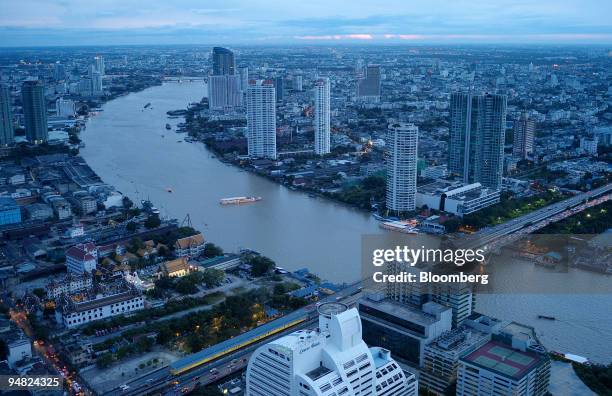 The Chao Praya river winds through the city of Bangkok, Thailand, on Saturday, Aug. 23, 2008. Thailand's economic growth probably slowed for the...