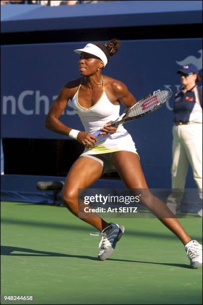 Fleet-footed Venus Williams on her toes as she reacts to a shot from Jennifer Capriati during their semi-final match at Arthur Ashe Stadium.