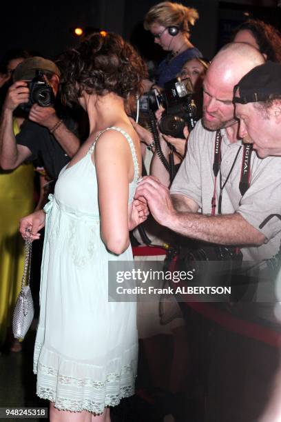 June 6, 2005 Photographers look for designer label on Rachel Leigh Cook's dress at the TNT premiere of "Into The West." Photo by Frank Albertson.
