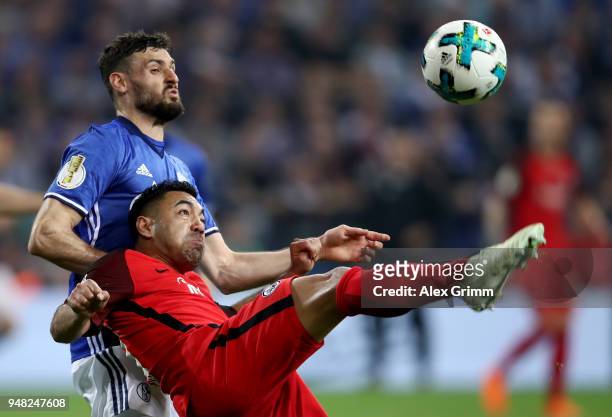 Daniel Caligiuri of Schalke and Marco Fabian of Frankfurt battle for the ball during the Bundesliga match between FC Schalke 04 and Eintracht...
