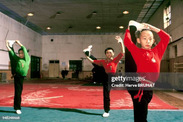 Class of " Legs". The children learn to raise their leg to the height of their face, then walk with their arms stretched out above them, and with...