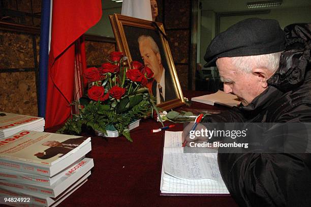 Mourner pays respects to former Yugoslavian president Slobodan Milosevic at a memorial in Belgrade, Serbia and Montenegro, Sunday, March 12, 2006....