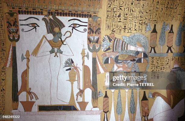 Osiris sur un socle prenant la forme du signe servant à écrire Maât. Représentation murale de la 20ème dynastie dans la tombe de SENNEDJEM, serviteur...