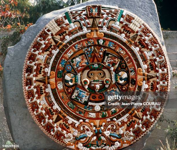Color reconstitution of an AZTEC Calendar or Sun Stone preserved at the Baja California Museum of Mexico. Different colored reproductions of this...