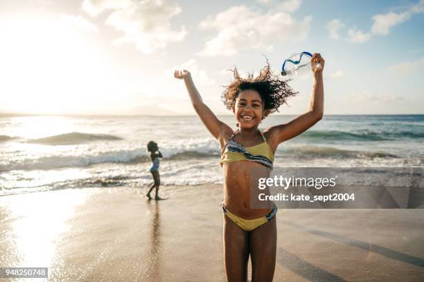 pret van de zomer - african girls on beach stockfoto's en -beelden