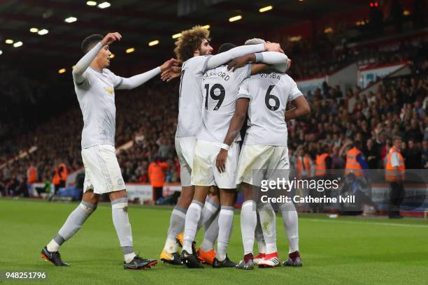 Romelu Lukaku of Manchester United celebrates with teammates after scoring his sides second goal during the Premier League match between AFC...