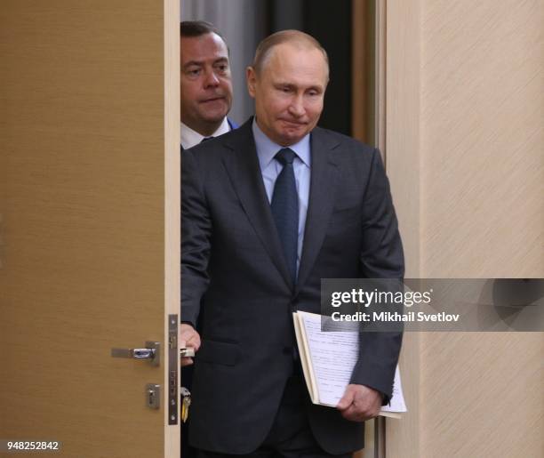 Russian President Vladimir Putin and Prime Minister Dmitry Medvedev enter the hall during their weekly meeting with ministers of Russian Governmnet...