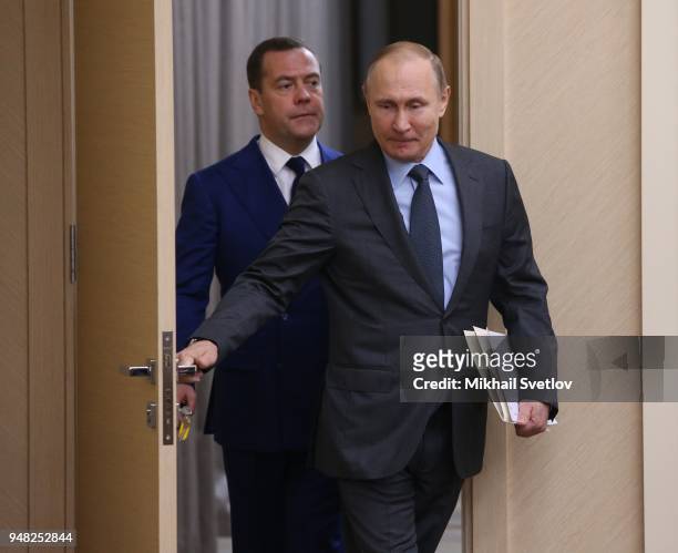 Russian President Vladimir Putin and Prime Minister Dmitry Medvedev enter the hall during their weekly meeting with ministers of Russian Governmnet...