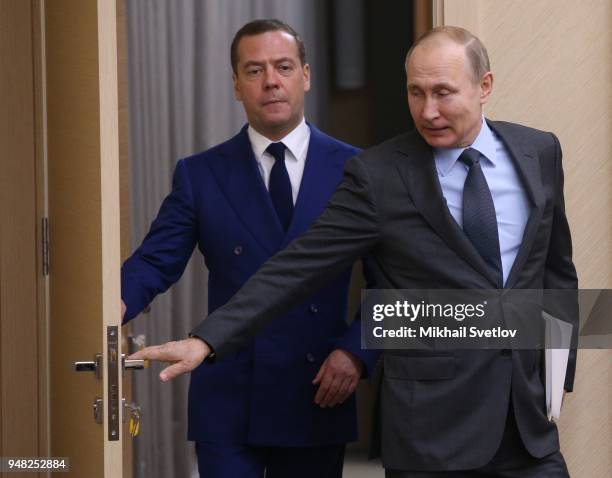 Russian President Vladimir Putin and Prime Minister Dmitry Medvedev enter the hall during their weekly meeting with ministers of Russian Governmnet...