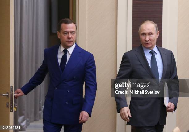 Russian President Vladimir Putin and Prime Minister Dmitry Medvedev enter the hall during their weekly meeting with ministers of Russian Governmnet...