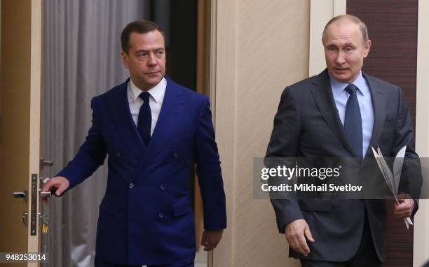 Russian President Vladimir Putin and Prime Minister Dmitry Medvedev enter the hall during their weekly meeting with ministers of Russian Governmnet...