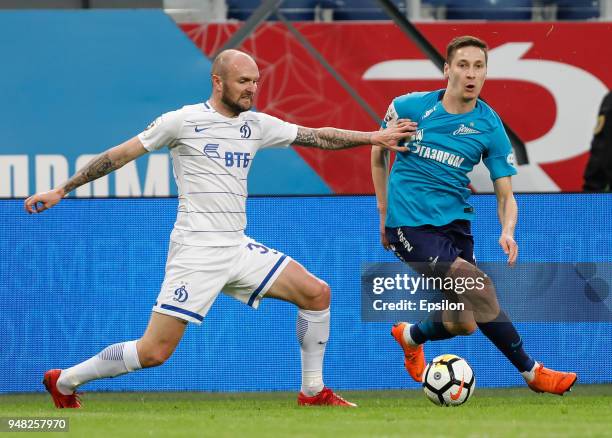 Daler Kuzyaev of FC Zenit Saint Petersburg and Konstantin Rausch of FC Dinamo Moscow vie for the ball during the Russian Football League match...