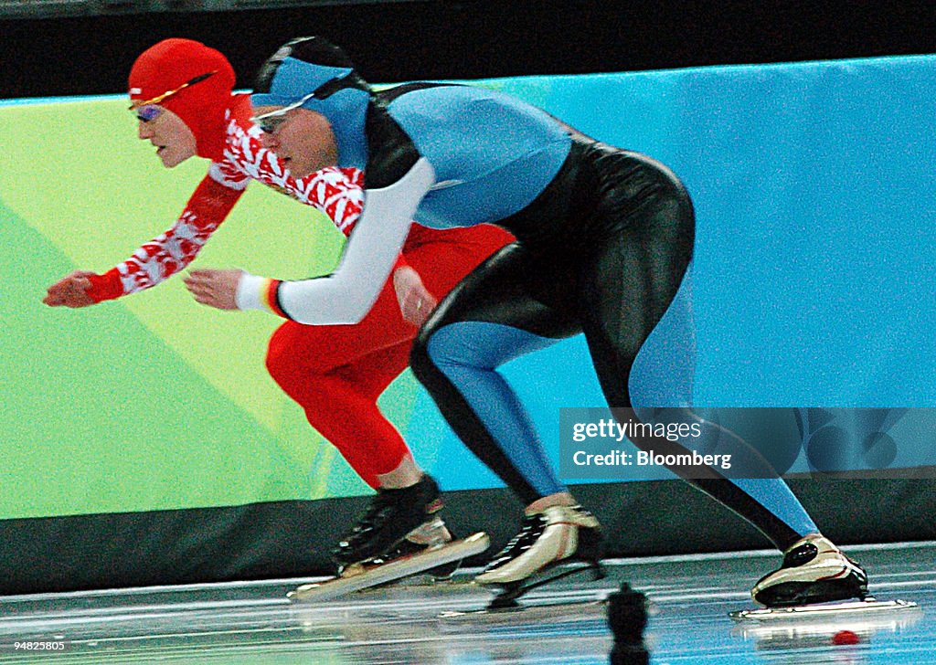 Russian speed skater Svetlana Zhurova, left, races against G
