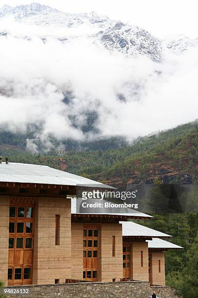 Guest rooms at Amankora Hotel in Paro, Bhutan, are seen in the foreground, as snow capped mountains are seen in the distance on Saturday, March 11,...