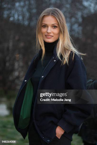 Lithuanian supermodel Edita Vilkeviciute wears a black varsity jacket after the Alberta Ferretti show during Milan Fashion Week Fall/Winter 2018/19...