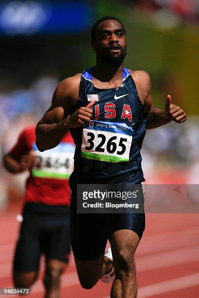 Tyson Gay of the U.S., runs in the fifth heat of the men's 100-meter Athletics preliminary event on day seven of the 2008 Beijing Olympics in...