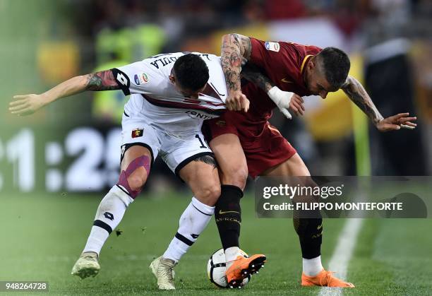 Roma's defender from Serbia Aleksandar Kolarov vies with Genoa's forward Gianluca Lapadula during the italian Serie A football match Roma vs Genoa at...