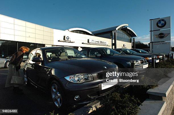 Bridget Carey from Dublin browses some of the new BMW cars at Maxwell Motors, Blackrock Dublin Ireland, Friday, December 23, 2005.