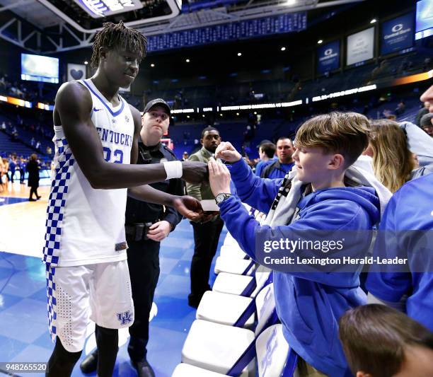 Kentucky Wildcats forward Wenyen Gabriel signs an autograph after the University of Kentucky defeated Louisiana State University in Rupp Arena...