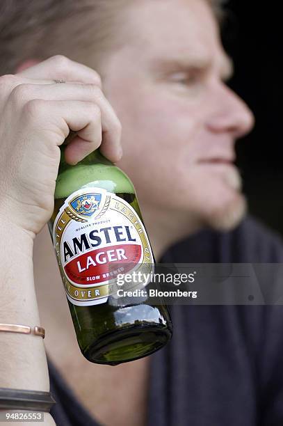 Customer drinks an Amstel Lager beer at a bar in Melville, Johannesburg, South Africa, Sunday, May 16, 2004. SABMiller Plc, the world's...