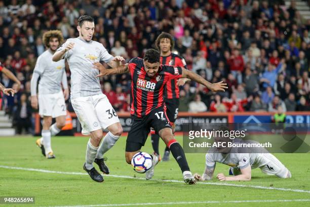 Joshua King of Bournemouth gets between Matteo Darmian of Manchester Utd and Phil Jones of Manchester Utd during the Premier League match between AFC...