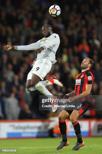 Romelu Lukaku of Manchester United wins a header as Steve Cook of AFC Bournemouth goes down during the Premier League match between AFC Bournemouth...