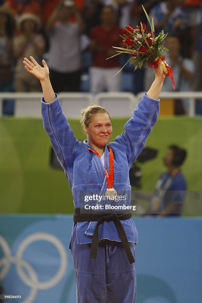 Ronda Rousey of the U.S., stands on the podium after winning