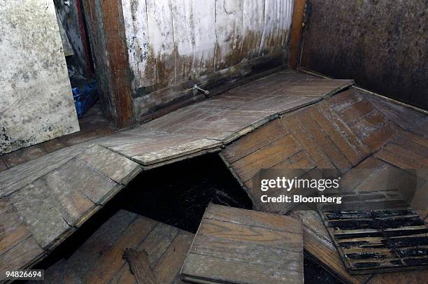 Buckled floors caused by Hurricane Katrina in Karen Charbonnet's home in New Orleans, Louisiana are pictured on December 22, 2005. Ms. Charbonnet,...