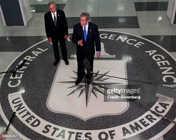President George W. Bush and Porter Goss, director of the Central Intelligence Agency, left, answer questions from the media after President Bush met...