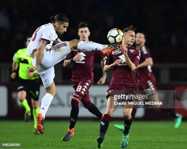 Milan's Swiss defender Ricardo Rodriguez vies with Torino's Italain forward Simone Edera during the Italian Serie A football match Torino vs AC Milan...