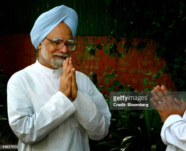 Former Indian Finance Minister and National Congress party leader Manmohan Singh welcomes guests to his residence in New Delhi, India, on Friday May...