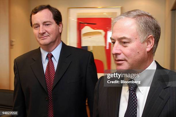 Peter Tomsett, president and chief executive officer of Placer Dome Inc. Left, and Greg Wilkins, president and chief executive officer of Barrick...