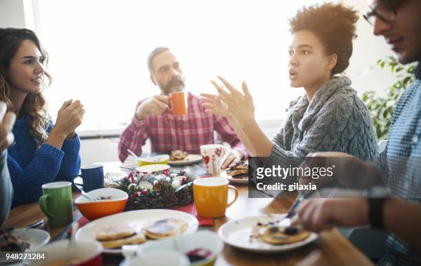 family having lunch. - family at dining table stock pictures, royalty-free photos & images