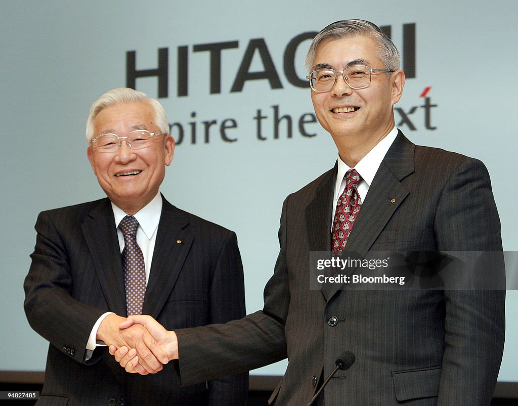 Hitachi Ltd.'s outgoing President Etsuhiko Shoyama, left, sh