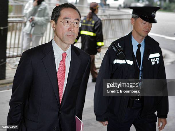Hong Kong Financial Secretary Henry Tang arrives at Hong Kong's Central Government Offices to see Chief Executive Tung Chee-Hwa before Tung leaves...