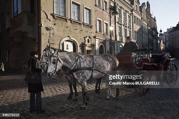 Coach in the Old Market Square or Stary Rynek in Poznan in Poland, on November 12, 2011. The central square of the city established in 1253 on the...