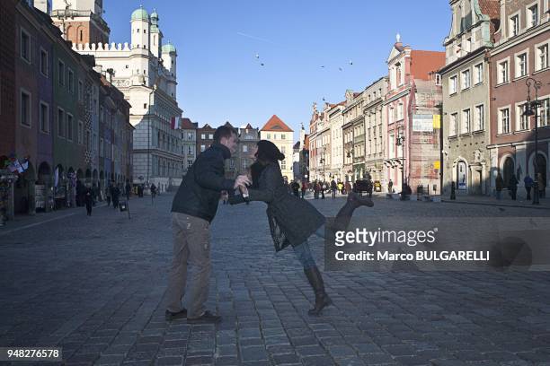 Couple dance in Old Market Square or Stary Rynek in Poznan in Poland, on November 12, 2011. The central square of the city established in 1253 on the...