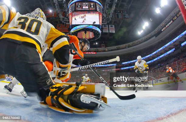 Michael Raffl of the Philadelphia Flyers attempts to deflect a shot on goal against Matt Murray of the Pittsburgh Penguins in Game Three of the...