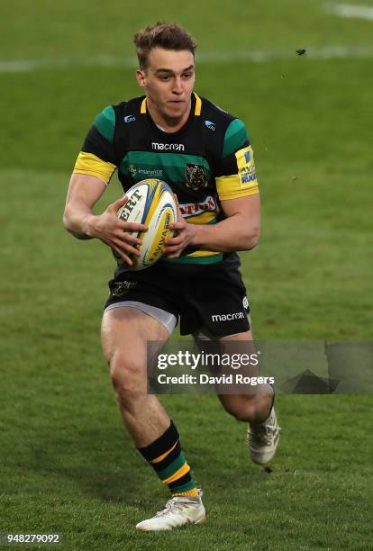 Tom Emery of Northampton Saints runs with the ball during the Mobbs Memorial match between Northampton Saints and the British Army at Franklin's...