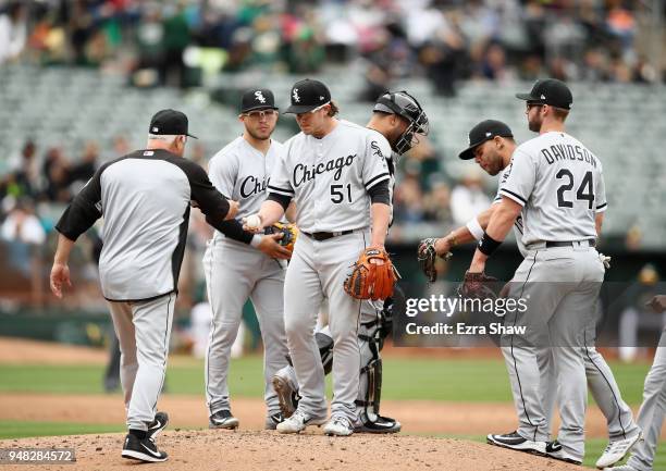 Manager Rick Renteria of the Chicago White Sox takes out Carson Fulmer in the second inning against the Oakland Athletics at Oakland Alameda Coliseum...