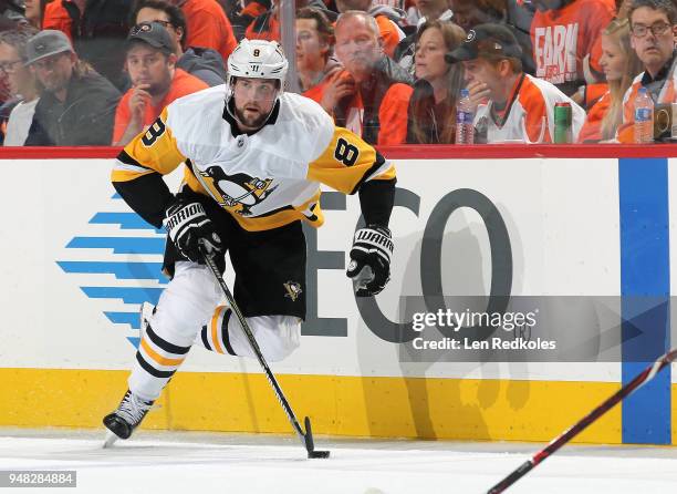 Brian Dumoulin of the Pittsburgh Penguins skates the puck against the Philadelphia Flyers in Game Three of the Eastern Conference First Round during...