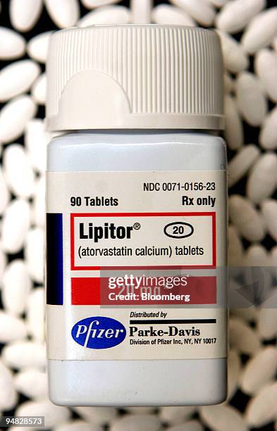 Lipitor tablets are arranged underneath a bottle of the Pfizer cholesterol drug in a Boston, Massachusetts pharmacy Monday, December 19, 2005. Shares...