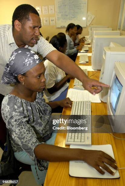 Students learn computer skills at Alexsan Kopana community center, Alexandra township, South Africa, Thursday, April 22, 2004. As the African...