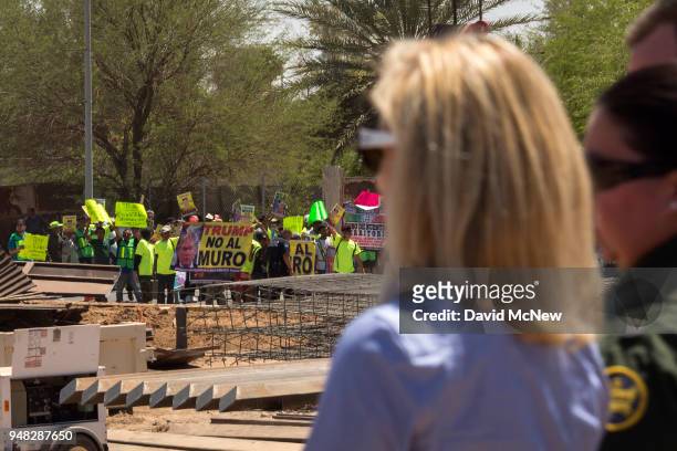 Protesters on the Mexico side of the border demonstrate against policies of President Donald Trump as U.S. Department of Homeland Security Secretary...