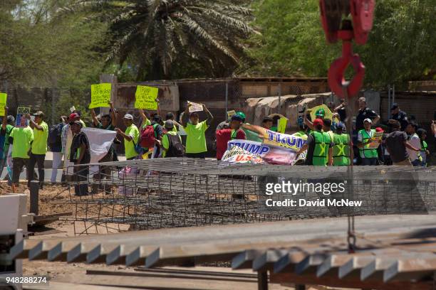 Protesters on the Mexico side of the border demonstrate against policies of President Donald Trump as U.S. Department of Homeland Security Secretary...