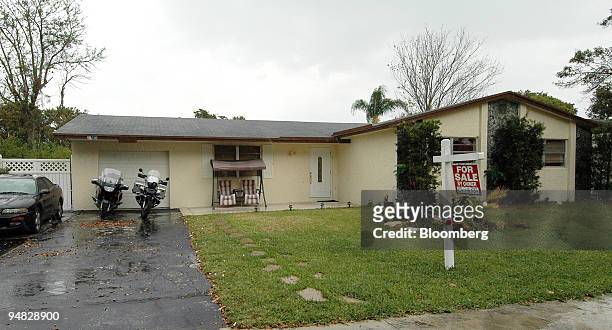 For Sale sign is pictured in the front yard of this 1,850 square foot home in Cooper City, Florida, listed by owner at $316,700 on February 25, 2005....