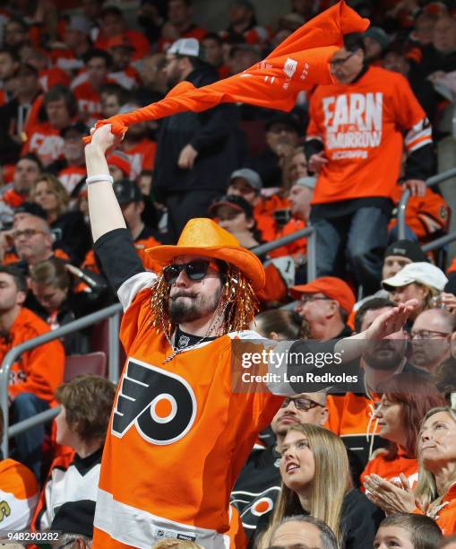 Fan of the Philadelphia Flyers celebrates a second period goal against the Pittsburgh Penguins in Game Three of the Eastern Conference First Round...