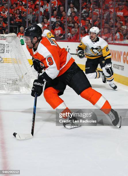 Ivan Provorov of the Philadelphia Flyers skates the puck against Sidney Crosby of the Pittsburgh Penguins in Game Three of the Eastern Conference...