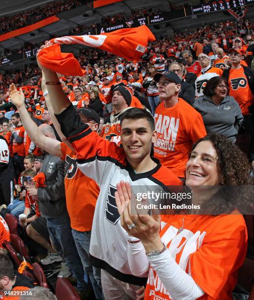 Fans of the Philadelphia Flyers celebrate a second period goal against the Pittsburgh Penguins in Game Three of the Eastern Conference First Round...